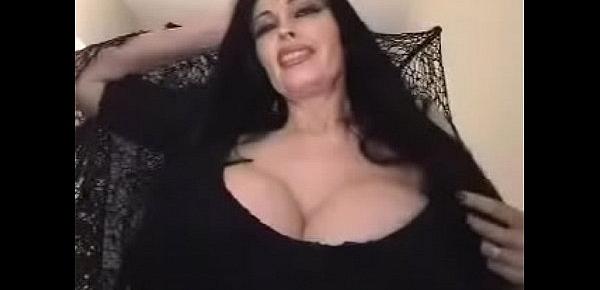   teddi barrett big boob in black dress on stair